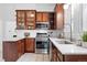 Kitchen features stainless steel appliances, granite countertops, and wood cabinetry at 3330 W 30Th Ave, Denver, CO 80211