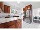 Kitchen features stainless steel appliances, granite countertops, and bright natural lighting at 3330 W 30Th Ave, Denver, CO 80211