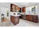 Charming kitchen features stainless steel appliances, granite countertops, and wood cabinetry at 3330 W 30Th Ave, Denver, CO 80211