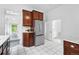 Kitchen features stainless steel appliances, granite countertops, and wood cabinetry at 3330 W 30Th Ave, Denver, CO 80211