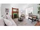 Inviting living room with a decorative fireplace and open layout to dining area at 3330 W 30Th Ave, Denver, CO 80211