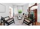 Cozy living room featuring a fireplace, stylish seating, and neutral decor at 3330 W 30Th Ave, Denver, CO 80211