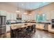 Gourmet kitchen with granite countertops, stainless steel appliances, and a large island at 15637 Deer Mountain Cir, Broomfield, CO 80023