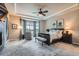 Bright and airy main bedroom with a bay window and elegant furnishings at 15637 Deer Mountain Cir, Broomfield, CO 80023