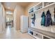 Hallway with bench seating, storage, and a refrigerator at 15637 Deer Mountain Cir, Broomfield, CO 80023