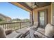 Outdoor porch showcases comfortable seating and open views of neighborhood at 15637 Deer Mountain Cir, Broomfield, CO 80023
