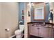 Stylish powder room with a unique vessel sink and decorative fixtures at 15637 Deer Mountain Cir, Broomfield, CO 80023