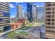 Enjoy unobstructed city views from this luxurious residence featuring lush greenery, walking paths, and skyscrapers at 1777 Larimer St # 902, Denver, CO 80202