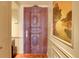 Beautiful entryway with an ornate wooden door and unique artwork at 1777 Larimer St # 902, Denver, CO 80202
