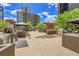 Outdoor grilling area equipped with stainless steel grills, counter space, and lush greenery for delightful barbecues at 1777 Larimer St # 902, Denver, CO 80202