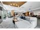 Spacious living room with a sectional sofa, fireplace, and ample seating, creating a comfortable and inviting atmosphere at 1777 Larimer St # 902, Denver, CO 80202