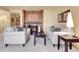 Cozy living room featuring matching sofas, a fireplace, and elegant decor at 1777 Larimer St # 902, Denver, CO 80202
