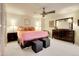 Comfortable main bedroom with carpet, ceiling fan, dresser, bedside tables, and neutral-toned walls at 1777 Larimer St # 902, Denver, CO 80202
