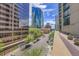 City street view featuring a tree-lined boulevard and stunning architectural buildings, showcasing urban charm and character at 1777 Larimer St # 902, Denver, CO 80202