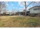 Large backyard with grassy area, shed, and patio at 11921 W 70Th Pl, Arvada, CO 80004