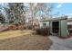 Green storage shed with double doors in backyard at 11921 W 70Th Pl, Arvada, CO 80004