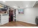Spacious basement closet with built-in shelving and hanging rods at 11921 W 70Th Pl, Arvada, CO 80004