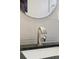 Close up of a modern bathroom vanity with a sleek faucet at 11921 W 70Th Pl, Arvada, CO 80004