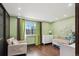 Bright Bedroom with hardwood floors, a crib, and ample natural light at 11921 W 70Th Pl, Arvada, CO 80004