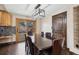 Dining area with dark wood table and chairs, access to backyard at 11921 W 70Th Pl, Arvada, CO 80004