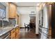 Kitchen with stainless steel appliances, granite countertops, and hardwood floors at 11921 W 70Th Pl, Arvada, CO 80004
