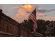 American flag with a picket fence blowing in the wind at 10405 W 107Th Pl, Broomfield, CO 80021