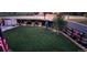 Large backyard with a lawn, garden, dark fencing with archways, and proximity to an intersection at 10405 W 107Th Pl, Broomfield, CO 80021