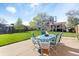 Spacious backyard with a patio, dining set, and well-maintained lawn, ideal for entertaining and relaxation at 10405 W 107Th Pl, Broomfield, CO 80021