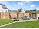 Large backyard with a basketball hoop, patio seating, green grass, and shed at 10405 W 107Th Pl, Broomfield, CO 80021