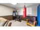 Basement home gym area with punching bag and weight machine at 10405 W 107Th Pl, Broomfield, CO 80021
