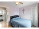 Bedroom with light purple walls and a full size bed at 10405 W 107Th Pl, Broomfield, CO 80021