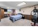 A versatile bedroom with a tv, weights and comfortable double bed at 10405 W 107Th Pl, Broomfield, CO 80021