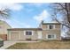 Charming two-story home with neutral-colored exterior, attached garage, and inviting front entrance at 10405 W 107Th Pl, Broomfield, CO 80021