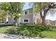Beautiful two-story home with mature trees, a well-kept lawn, and classic architecture, showcasing curb appeal at 10405 W 107Th Pl, Broomfield, CO 80021