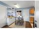 Dining Area with Bar, featuring stainless appliances, eat-in bar, and seamless flow to an adjacent space at 10405 W 107Th Pl, Broomfield, CO 80021