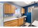 Well-lit kitchen featuring a modern sink, spacious countertops, and plentiful cabinet storage at 10405 W 107Th Pl, Broomfield, CO 80021