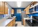 Functional kitchen with ample cabinet space, modern appliances, and tiled floor, perfect for cooking enthusiasts at 10405 W 107Th Pl, Broomfield, CO 80021