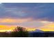 A view of the setting sun and mountains, creating a scenic backdrop for this property at 10405 W 107Th Pl, Broomfield, CO 80021