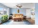Cozy living room filled with natural light, plush sofa, and modern décor creating a comfortable atmosphere at 10405 W 107Th Pl, Broomfield, CO 80021