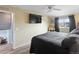 Comfortable main bedroom with tv, ceiling fan, and plenty of natural light at 10405 W 107Th Pl, Broomfield, CO 80021