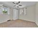 Inviting bedroom featuring carpet, ceiling fan, and built-in wardrobe at 3463 W Bowles Ave, Littleton, CO 80123