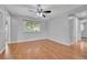 Spacious bedroom featuring hardwood floors, ceiling fan, and plenty of natural light at 3463 W Bowles Ave, Littleton, CO 80123