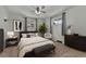 Cozy bedroom with neutral tones, a comfortable bed, and ample natural light at 3463 W Bowles Ave, Littleton, CO 80123
