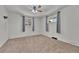 Comfortable bedroom with neutral carpet, ceiling fan, and large windows at 3463 W Bowles Ave, Littleton, CO 80123