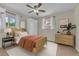 Bright bedroom featuring a wooden bed frame, warm accents, and great natural lighting at 3463 W Bowles Ave, Littleton, CO 80123