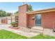 Charming red brick home featuring a well-kept lawn and a welcoming front entrance at 3463 W Bowles Ave, Littleton, CO 80123