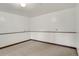 A finished room in the basement with carpeted floors at 10450 W 81St Pl, Arvada, CO 80005