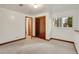 Bedroom with a window, carpet, and closet at 10450 W 81St Pl, Arvada, CO 80005