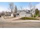 Charming home with a well-maintained yard, two-car garage and driveway at 10450 W 81St Pl, Arvada, CO 80005