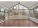 Bright and airy sunroom with hardwood floors and views of the backyard at 10450 W 81St Pl, Arvada, CO 80005